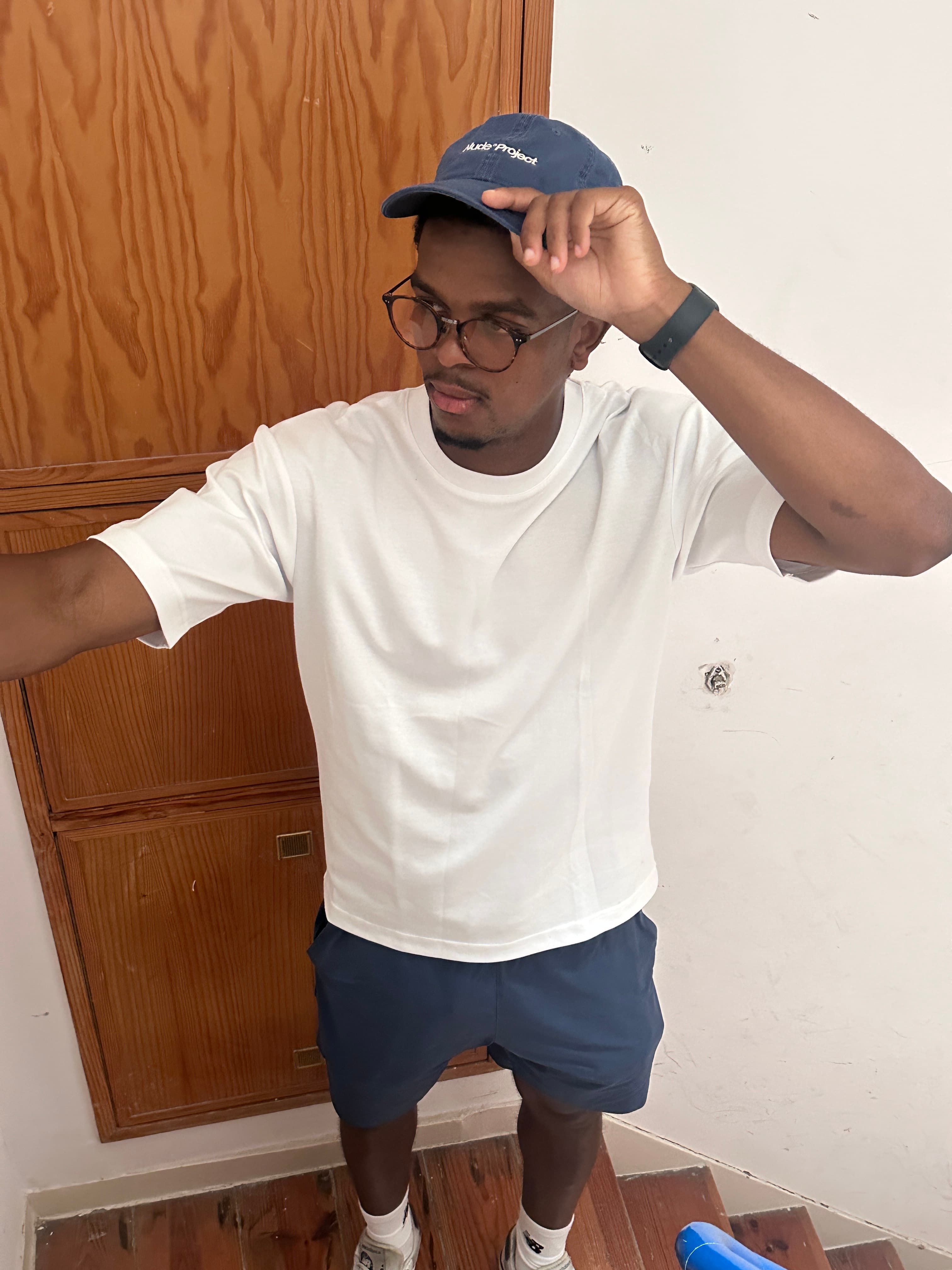 Rio Scott standing in a clothing store